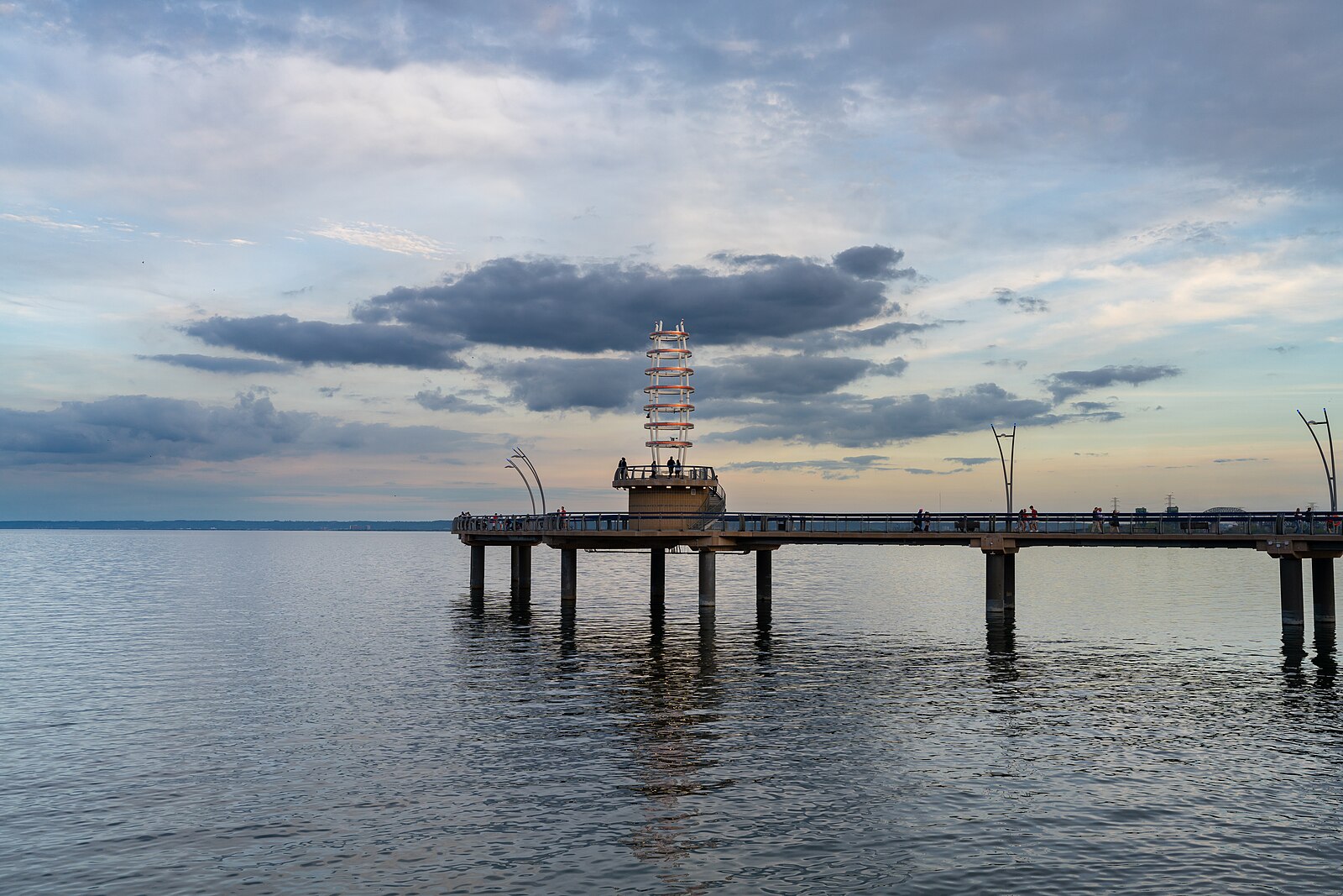 The curved arch and lighthouse at Brant Street Pier on Burlington's Lake Ontario waterfront